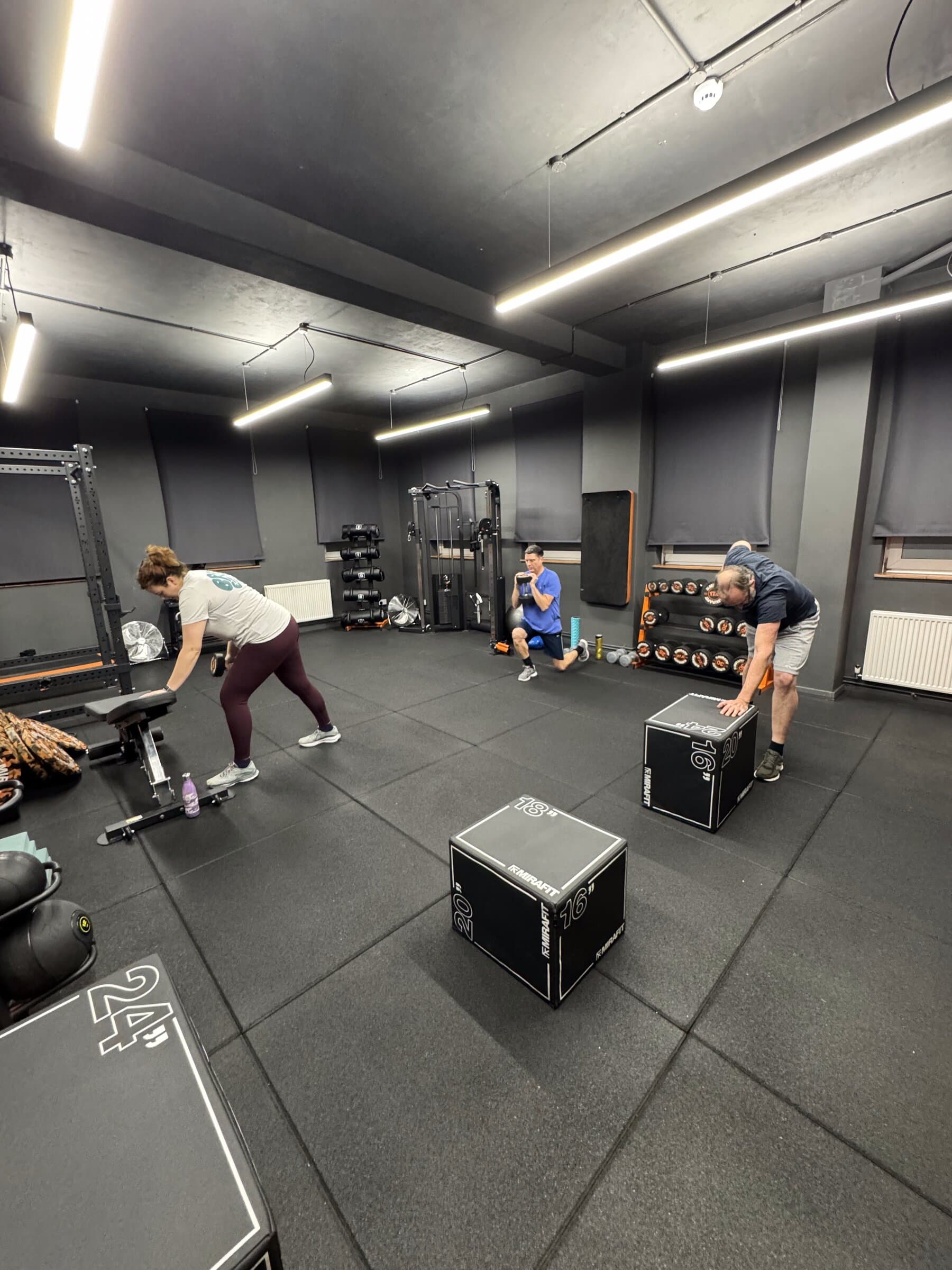 Wide view of the Gain gym floor with members training