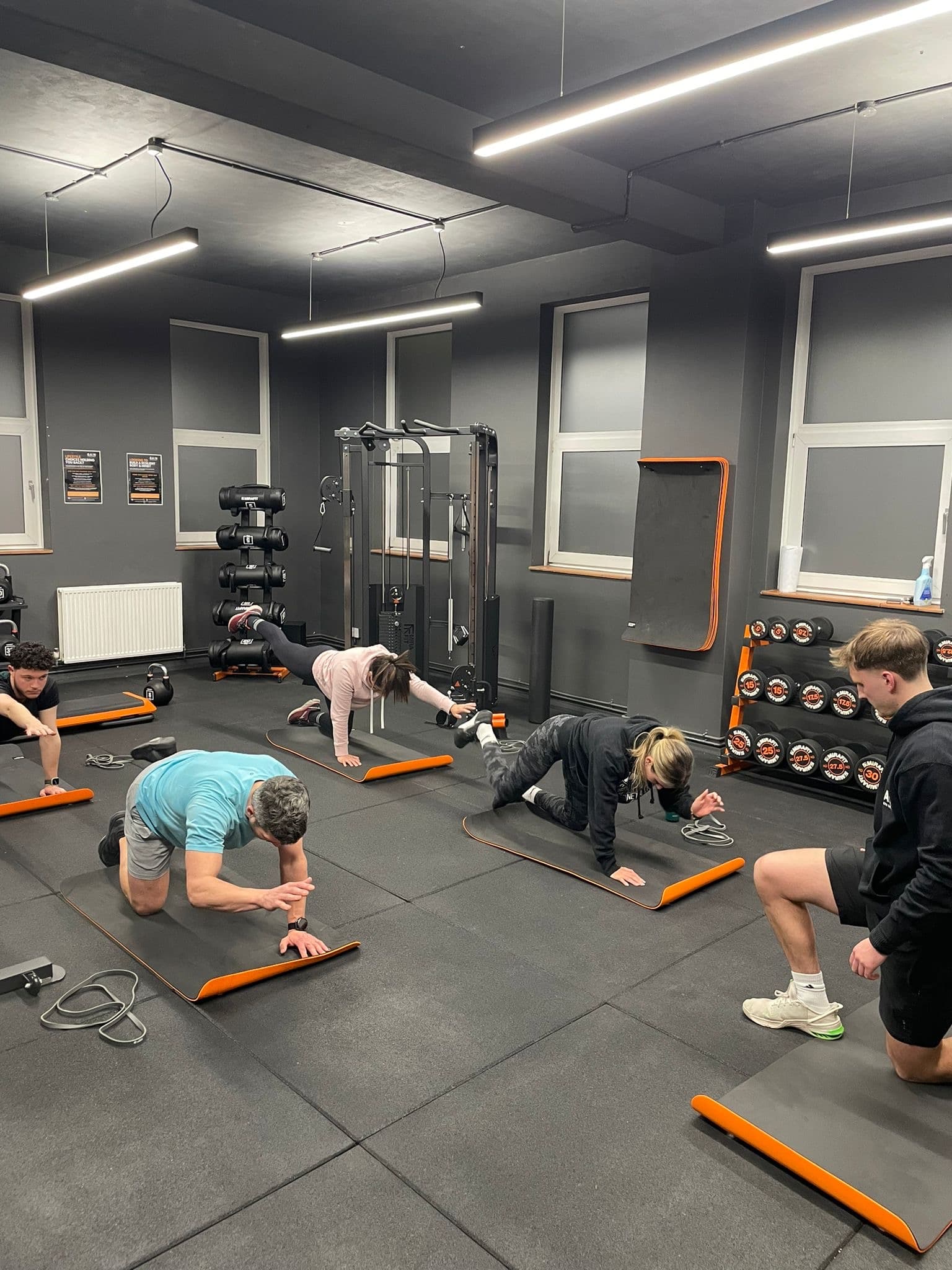 Hallum coaching a small group through a warm-up